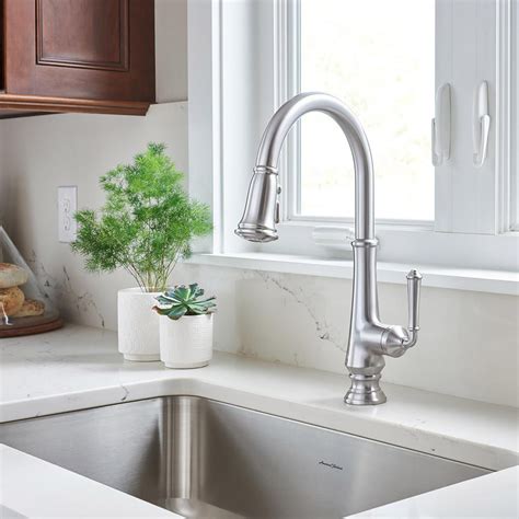 A modern property today should have functional faucets, with a modern design that is sleek yet strong in stature. American Standard Delancey Single-Handle Pull-Down Sprayer ...