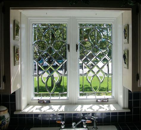 The simplest and safest way to install a stained glass panel in a window frame is to attach some hooks to the wooden part of the latter and use a chain or wire to hang the former. Beveled Windows, custommade.com | Window stained, Bathroom ...