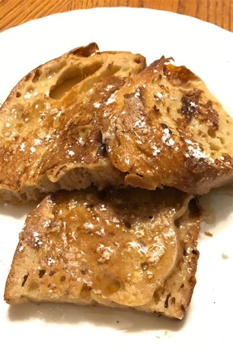 Two Pieces Of Bread Sitting On Top Of A White Plate