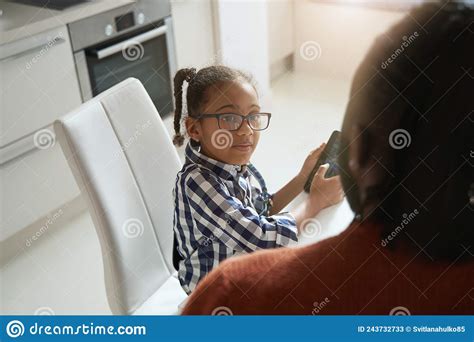 African American Girl Holding A Smartphone And Distracting For Her