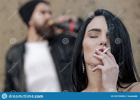 relationship of sensul couple man and woman girl smoking cigarette with smoke and blurred