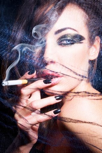 Portrait Of Glamorous Woman Smoking Cigarette Stock Photo Download