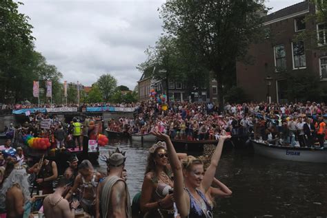 lgbt pride parade in amsterdam features boats as floats