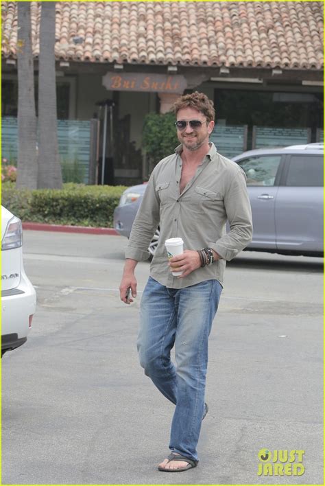 gerard butler scopes out surf gear after kissing session with mystery girl photo 3169569