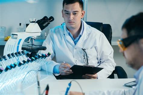 Scientist Working With Microscope In Lab Laboratory Research Concept