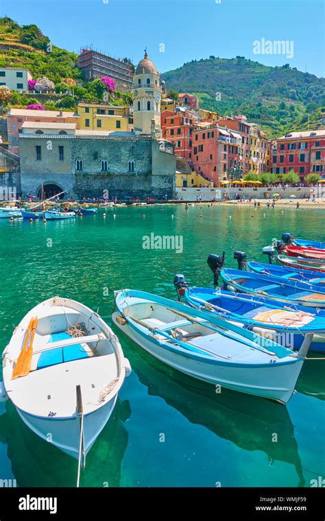 Boats At Harbour And Waterfront With Buildings By The Sea In Vernazza