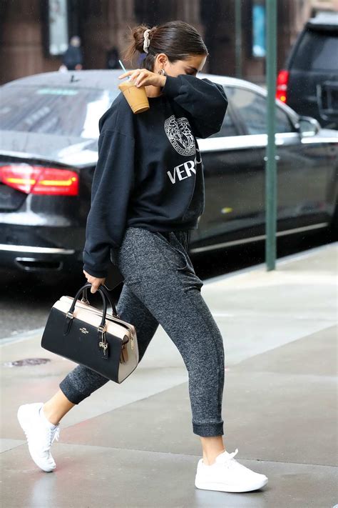 Selena Gomez Wears A Grey Versace Sweatshirt With Matching Sweatpants