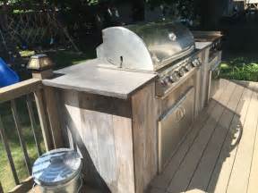 Will hare photography will hare photography in an outdoor setting inferior craftsmanship will de. Outdoor kitchen with grill and griddle station with ...