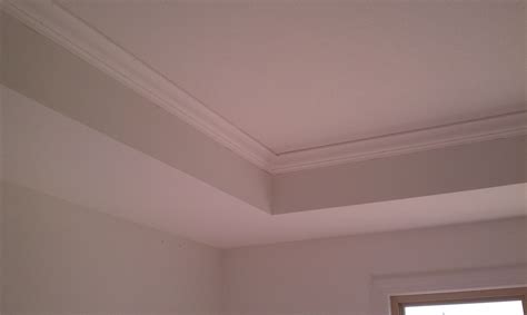 A tray ceiling should have more design than a pure rectangular indent and should not have a bunch of without the romantic low lighting hidden in the indent…makes no sense in a bedroom. Crown molding in the master bedroom tray ceiling | mark ...