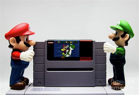 Mario And Luigi Putting Super Mario World In Snes Photograph By Toro
