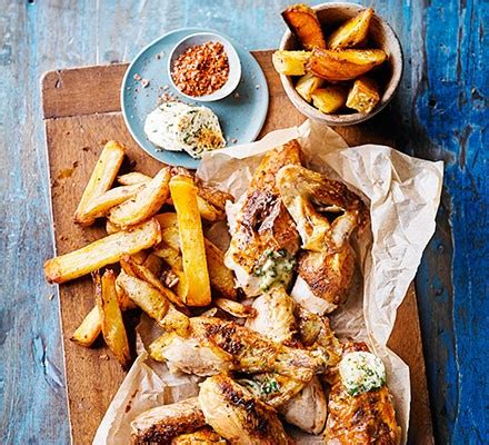 Chop up fresh herbs and tuck them. Quick roast chicken & homemade oven chips with Kiev butter recipe - BBC Good Food