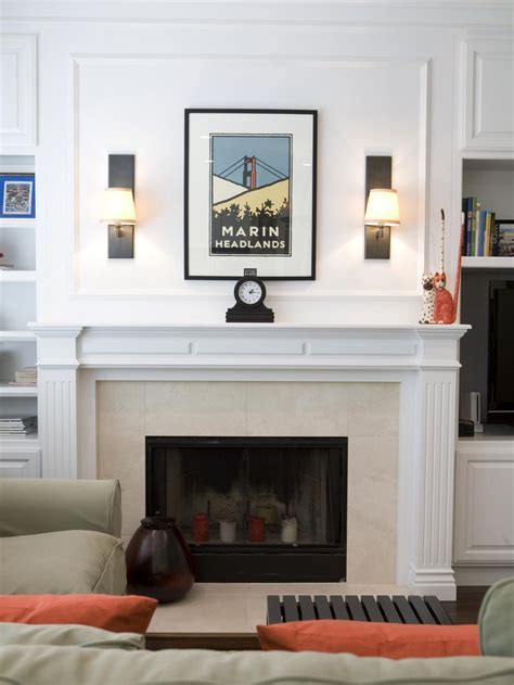 You can turn a weird wall into a focal point. Simple Living Room Fireplace Showcasing Art | HGTV