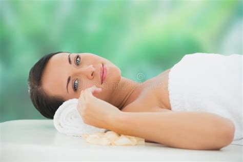 Beautiful Brunette Relaxing On Massage Table Smiling At Camera Stock Image Image Of Indoors