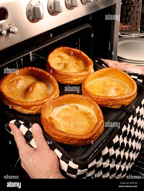 Man Cooking Giant Yorkshire Puddings Stock Photo Alamy