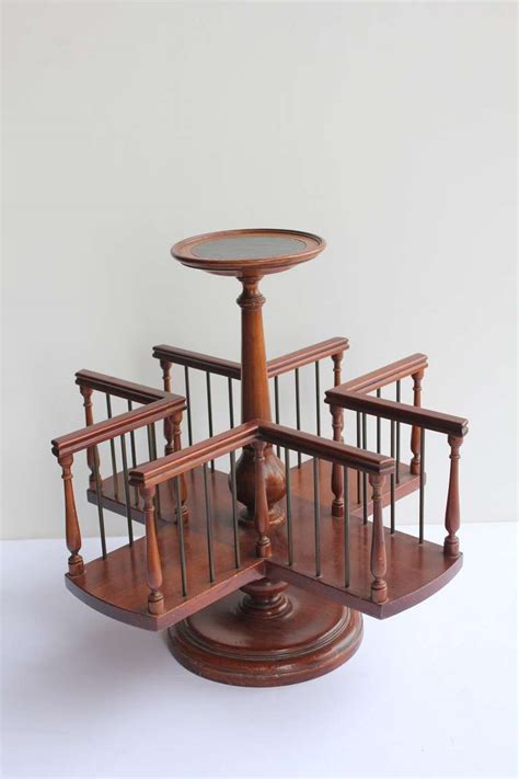 Difficult to find, early 20th century revolving book/magazine stand. Wood Revolving Desk Book Stand at 1stdibs