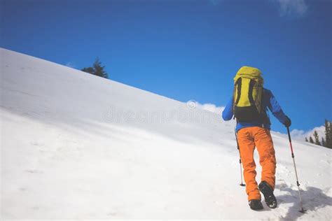 Mountain Climber Walks On A Snowy Slope Stock Photo Image Of