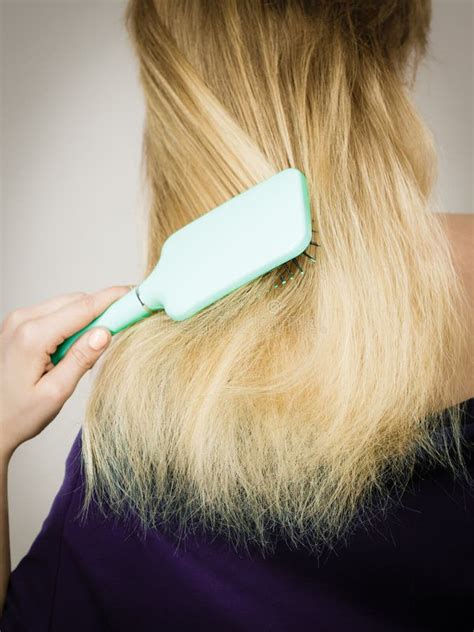 blonde woman brushing hair back view stock image image of everyday female 160287797