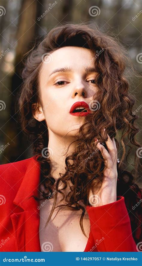 glamorous woman wearing red outfit and matching red lip gloss stock image image of bare