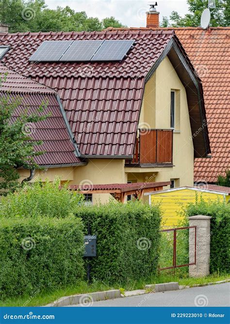 Renewable Energy from Sun. Modern House with Solar Panels Stock Photo