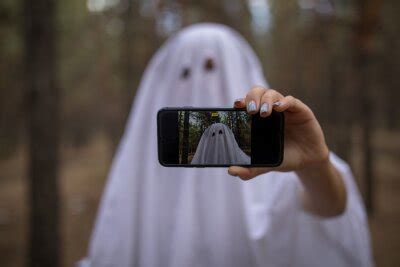 Woman In Halloween Ghost Costume Make Selfie In The Forest Wall Mural