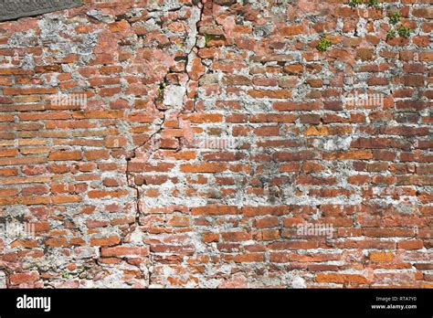 Old Cracked And Damaged Brick Wall Stock Photo Alamy