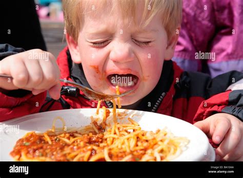 Young Boy Eating Spaghetti Stock Photo Alamy