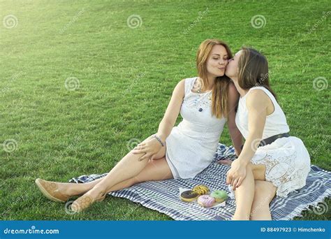 Two Girlfriends Kissing On The Street Stock Image Image Of Lying