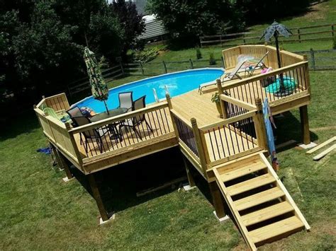 An Above Ground Swimming Pool With Stairs Leading To The Deck And Steps