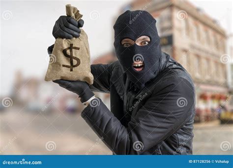 Happy Robber With Sack Full Of Dollars Royalty Free Stock Photo