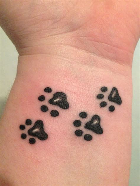 You can also find that a dog tattoo can be a symbol of a dominance and strength but only if it's an aggressive breed image. Dogs leave paw prints on your heart ... And your wrist ...