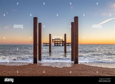 Brightons Iconic West Pier At Sunset With The Pebble Beach In The