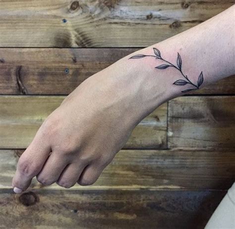 50 Amazing Wrist Tattoos For Men And Women Wrist Tattoos Tattoos Vine