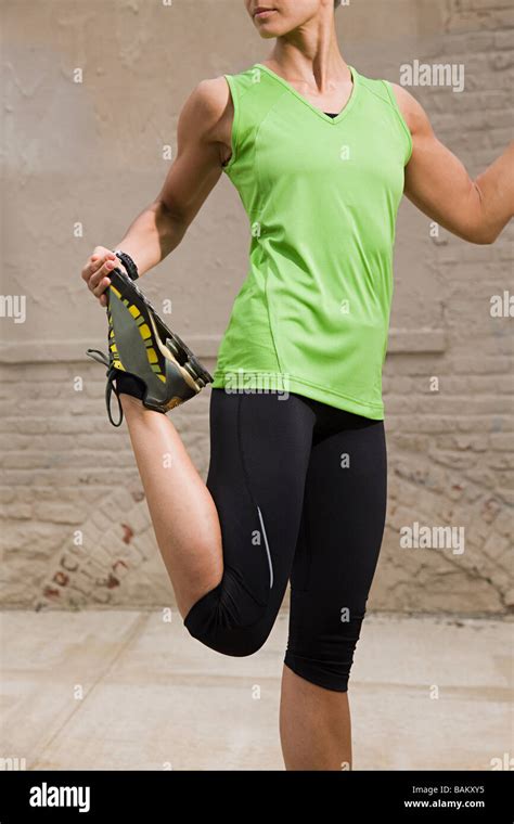 Runner Stretching Leg Stock Photo Alamy