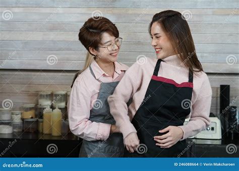 Young Asian Woman Lgbtq Lesbian Couple Working And Teasing Each Other