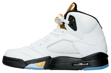 The white upper gets the olympic theme by utilizing the black and gold accents placed throughout the shoe. Air Jordan 5 Olympic White Black Gold Release Date - Sneaker Bar Detroit