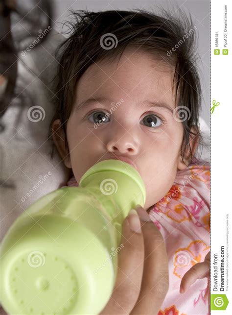 Baby Girl Drinks From Baby Bottle Stock Image Image Of
