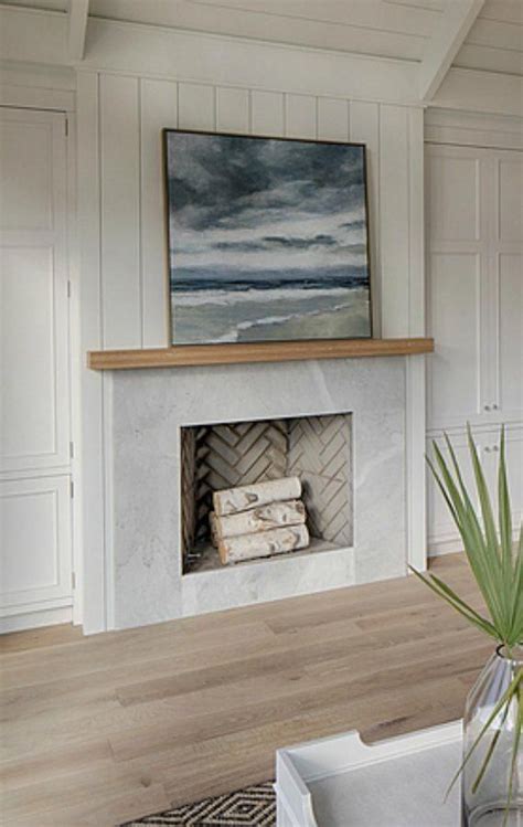 Simple And Classic Fireplace In A Coastal Cottage Living Room With