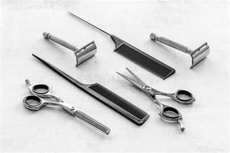 Set Of Barber Shop Equipment With Hairdressing Scissors And Combs Stock