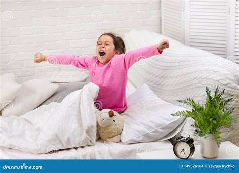 Little Child Girl Wakes Up From Sleep Stock Photo Image Of