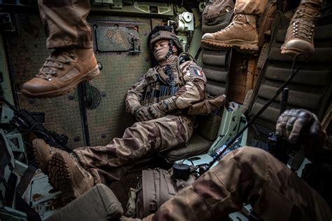 A French Foreign Legion soldier catching up on sleep inside an armored ...