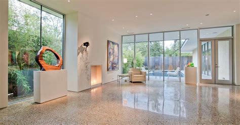 A concrete floor is laid out level with the sand. Polished Concrete Floors - House Seek