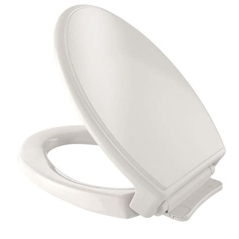 A White Toilet Seat With The Lid Up