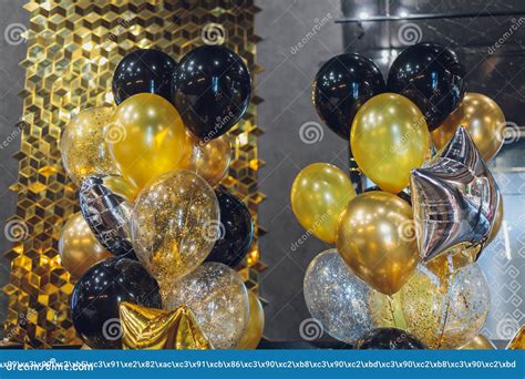 Black And Gold Helium Air Balloons On White Background Celebrate