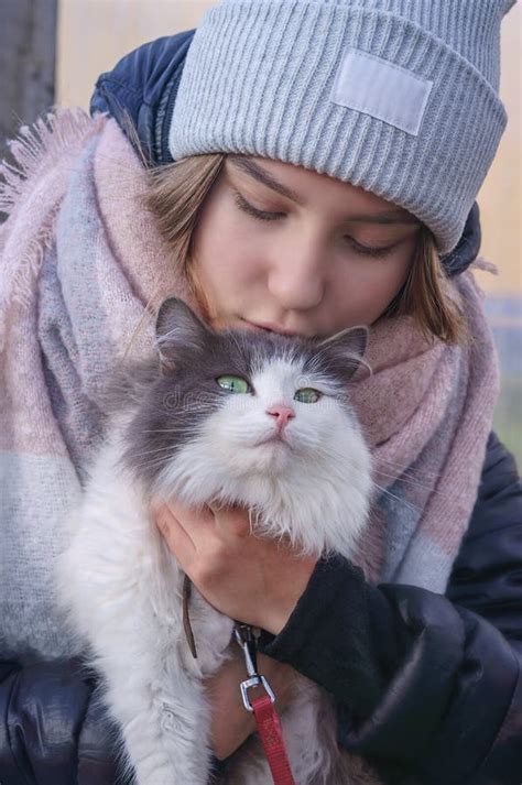 Girl Holding A Cat In Her Arms Stock Image Image Of Feline Care