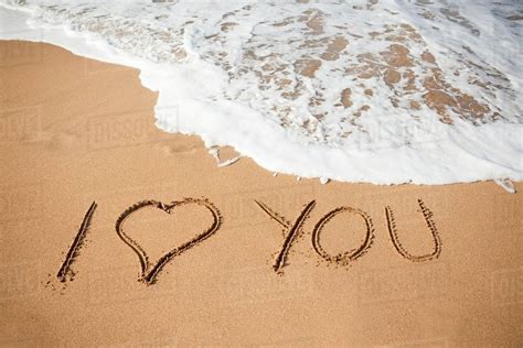 I Love You Written In Sand Stock Photo Dissolve