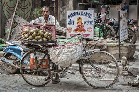 Unidentified Nepalese Men Selling Fruits In His Bike In The Streets Of Kathmandu Nepal