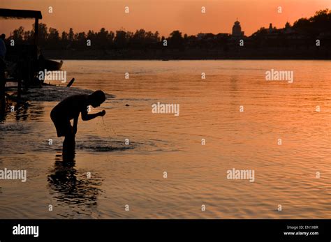 india uttarakhand rishikesh pilgrim performing ritual washing in the river ganges holy river
