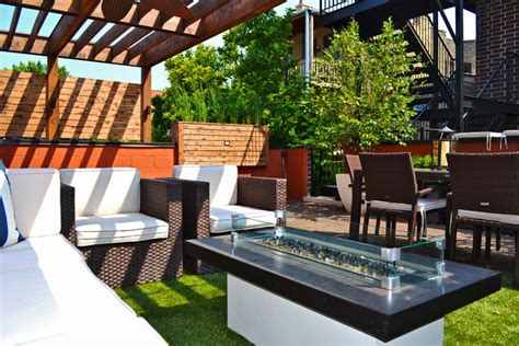 This 2 level deck features a 10' x 12' top deck completely covered by a decorative pergola. Chicago Rooftop Deck and Garden | 2014 | HGTV