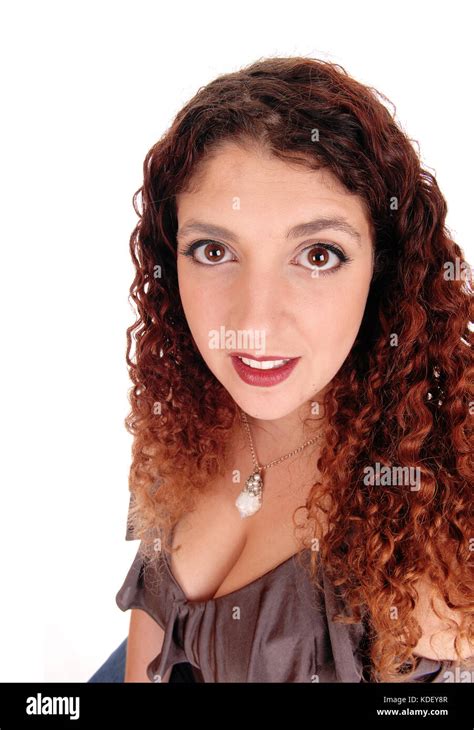 A Closeup Portrait Of A Beautiful Woman With Curly Brunette Hair Isolated For White Background