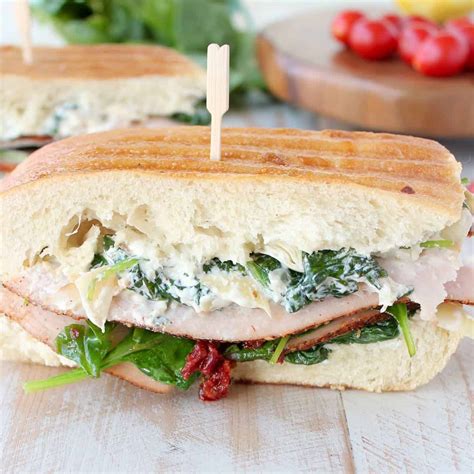 An easy and quick panini sandwich recipe made using just a grill pan; Spinach Artichoke Turkey Panini Recipe - WhitneyBond.com